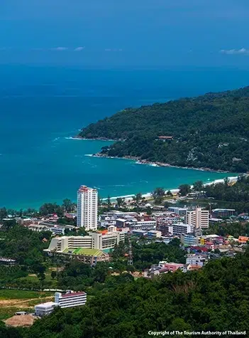 Wide sandy shoreline at Karon Beach in Phuket with turquoise Andaman Sea and tropical coastal scenery