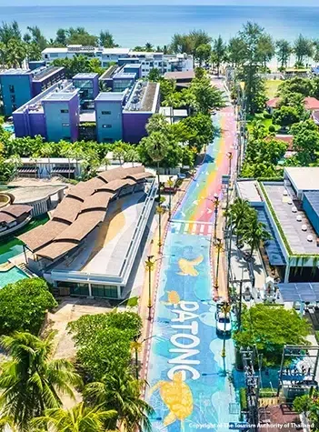 Patong Beach in Phuket with golden sand, turquoise Andaman Sea, and beachfront hotels in Thailand