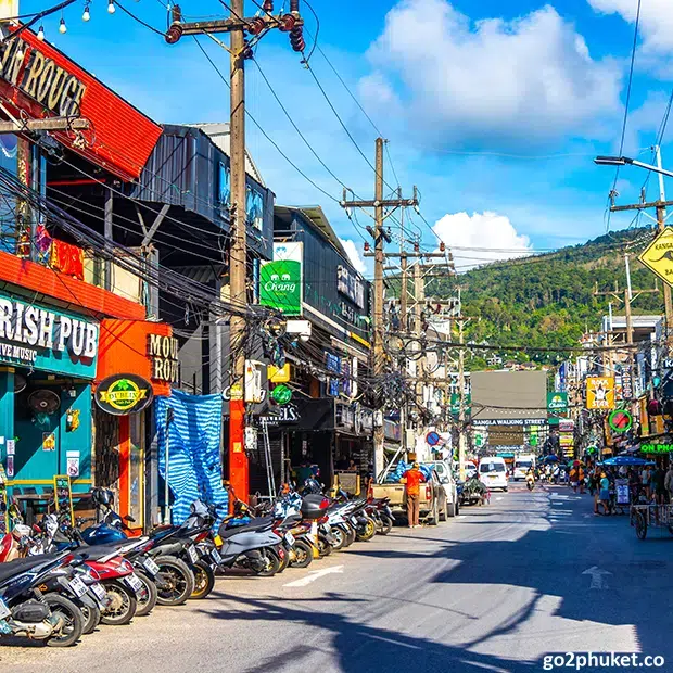 Bright neon lights and busy nightlife scene along Bangla Road near Patong Beach in Phuket, Thailand.