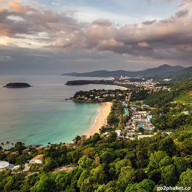 Aerial view of Kata Beach with turquoise Andaman Sea water and curved sandy shoreline in Phuket Thailand