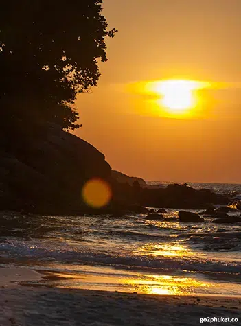 Clear turquoise water meeting soft white sand at Kata Beach in Phuket, Thailand